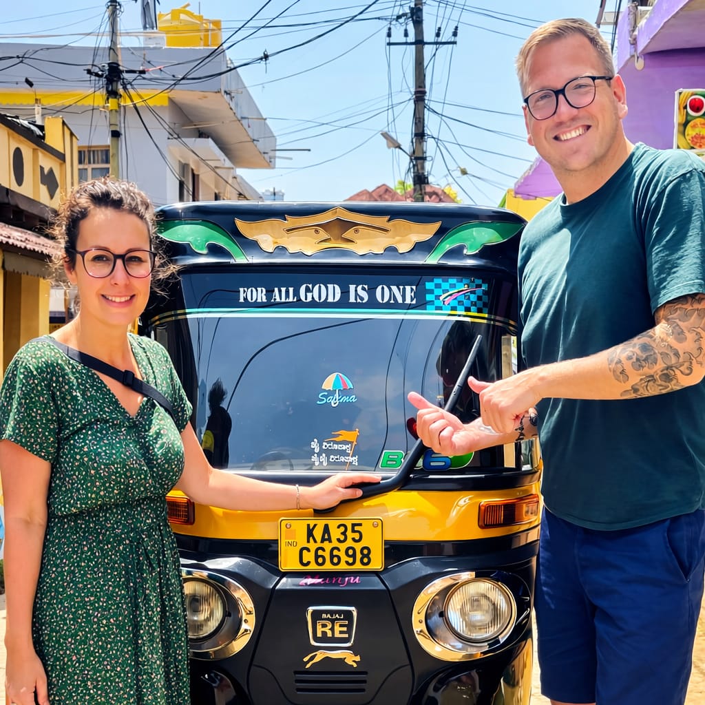 Solo female tourist giving thumbs up with Rocky's auto rickshaw at Hampi